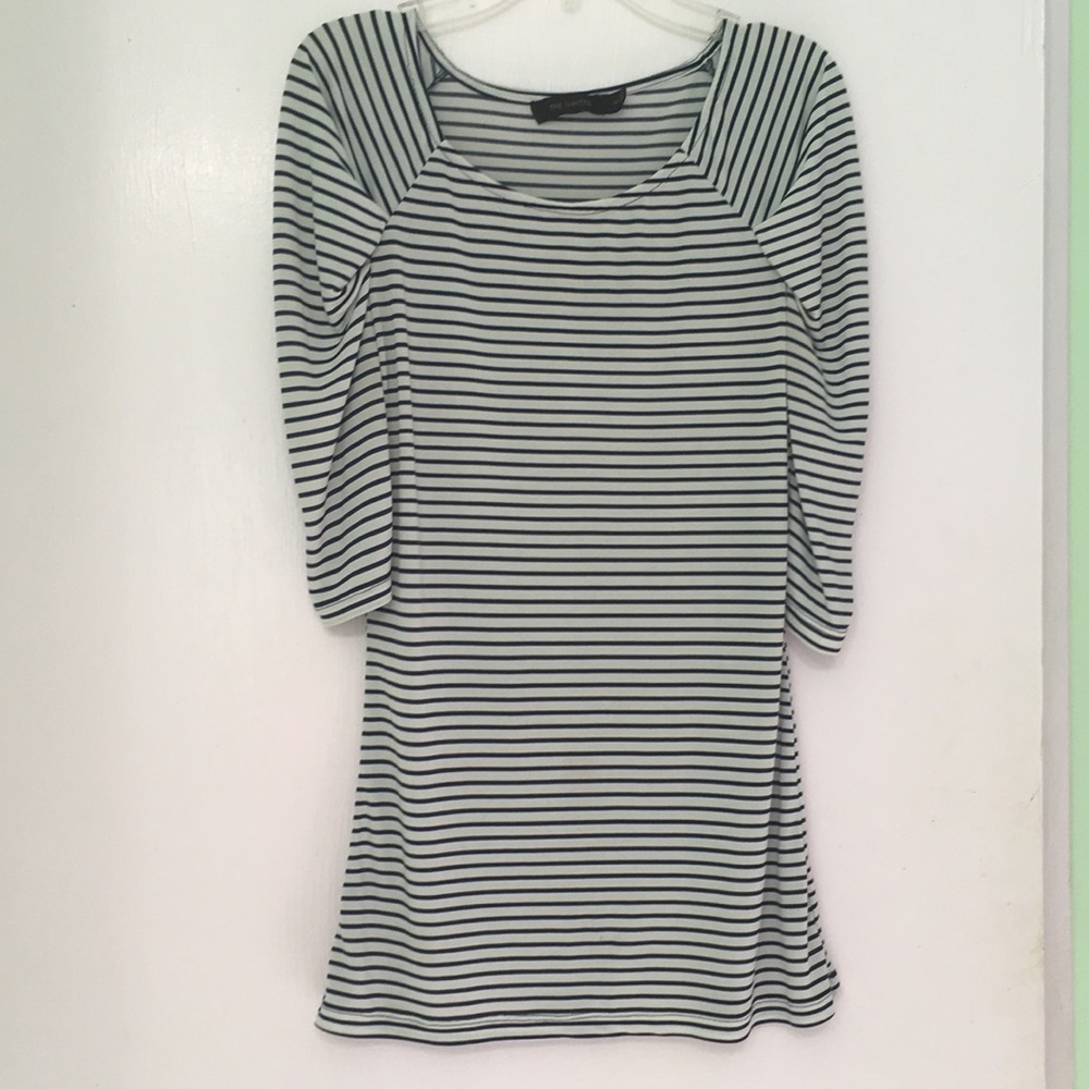 A navy blue and white striped blouse